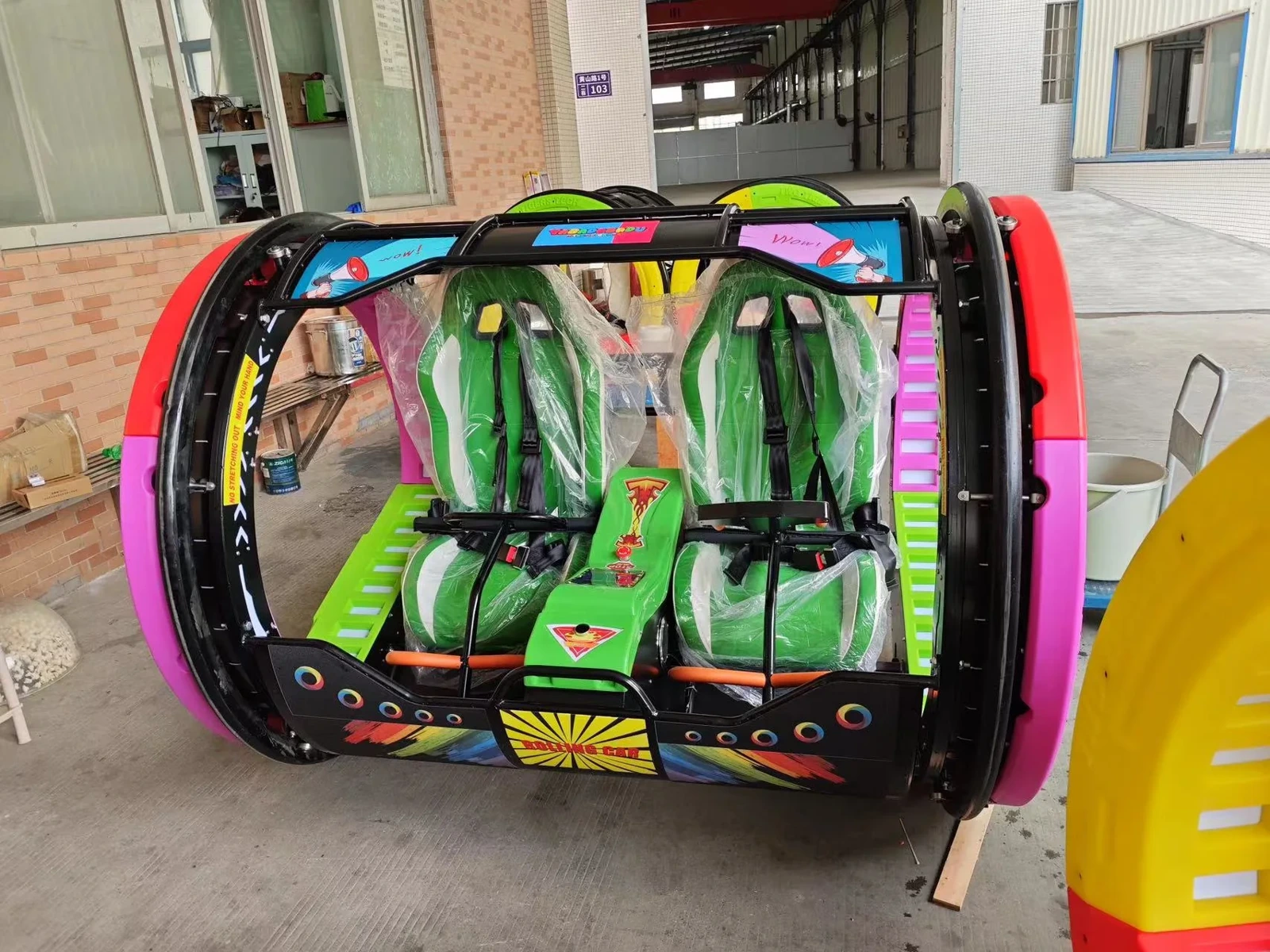 360 Rolling Car two-seat indoor ride, front view with racing seats and harnesses by JKPARKRIDES